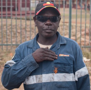 Photo of Yugul Mangi Ranger Ben Wilfred with Leichhardt’s Grasshopper on his chest