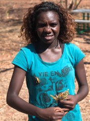 Photo of Petria Lingiari with Leichhardt’s Grasshopper on her chest