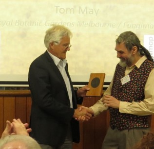 Photo of Tom May receiving 2014 Natural History Medallion