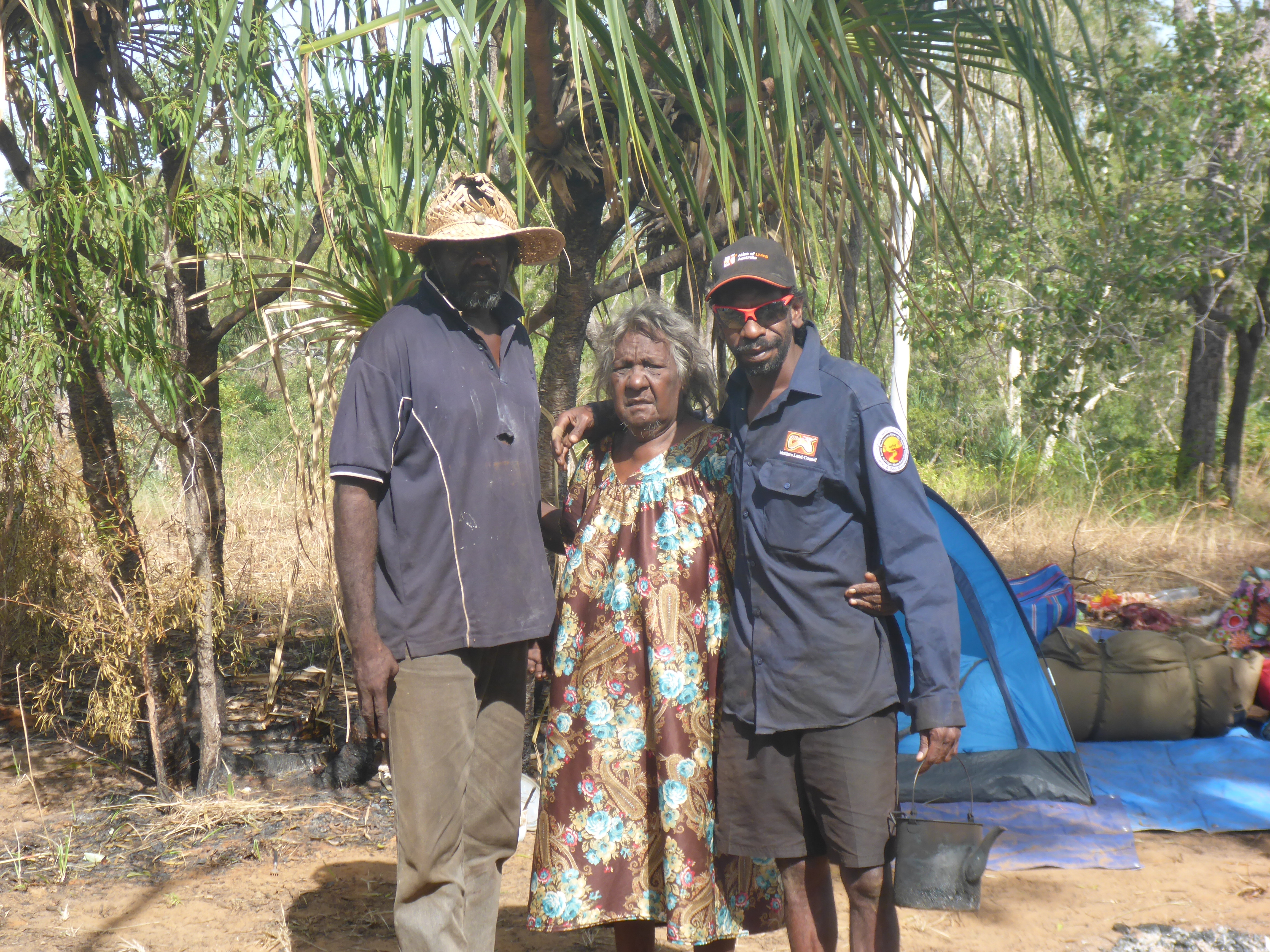Cherry Daniels (Ngandi Traditional Owner) surrounded by two Jungayi, Ernest Daniels and Kelvin Rogers, at the main campsite.