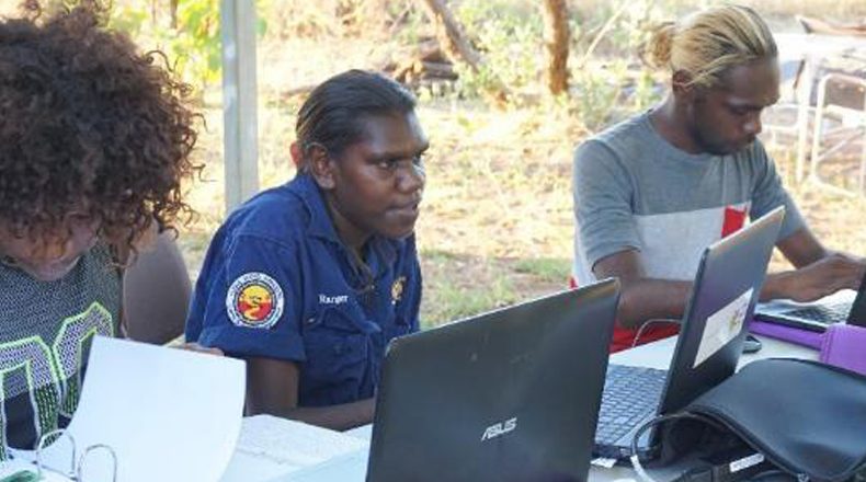 Image of IEK workers on computers in Arnhem Land