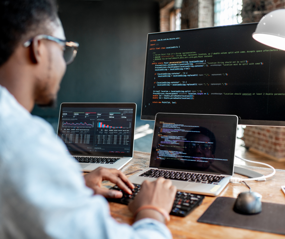 software developer coding at a computer